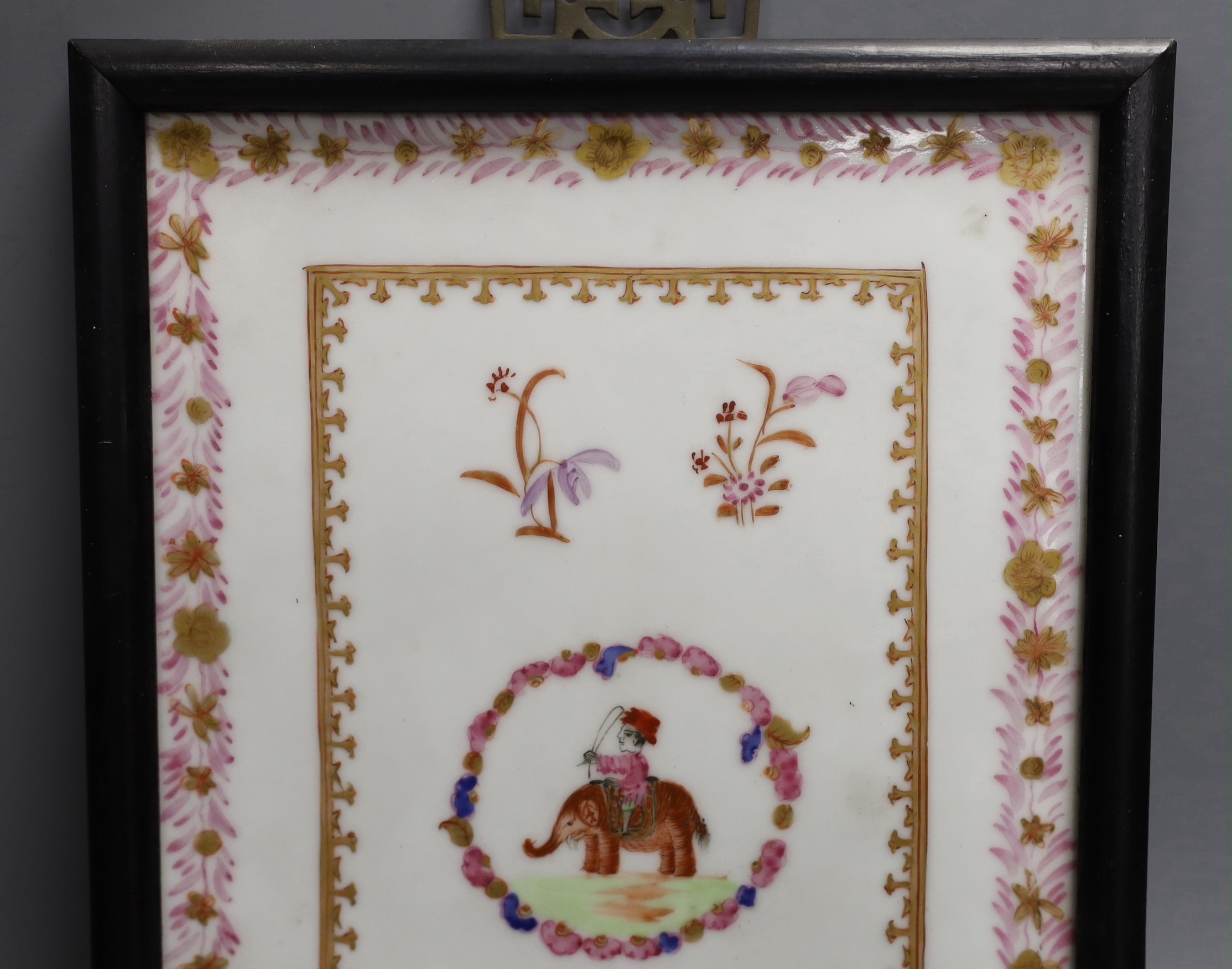 A framed Chinese export style famille rose porcelain plaque, 25x17cm